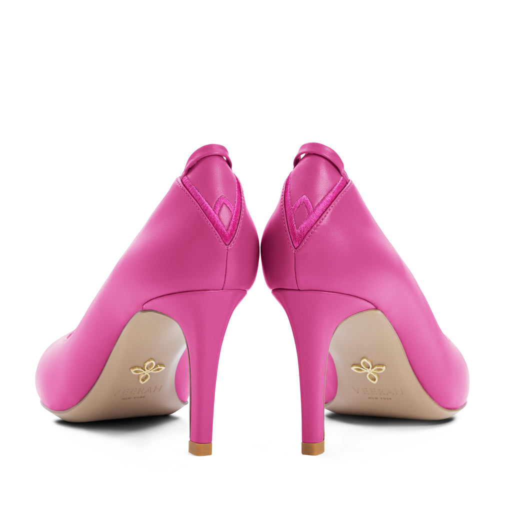 Hot pink pointed toe pumps in vegan leather