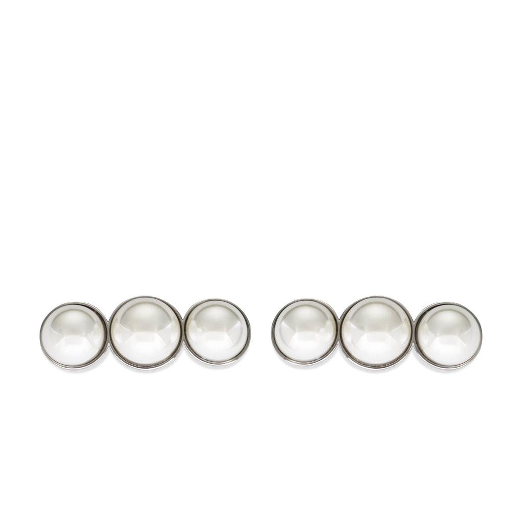 Elegant pearl shoe clips with three cabochon white pearls set in silver hardware, perfect for bridal and formal footwear accessories.