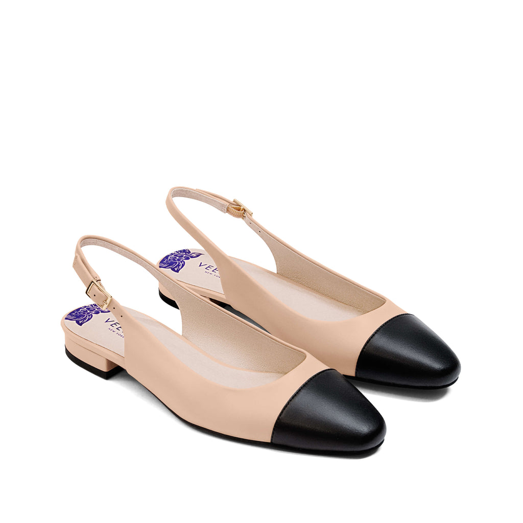 Elegant beige slingback vegan flats with black cap toe and low heel – sophisticated and versatile women's vegan shoes for work, casual, or formal wear.