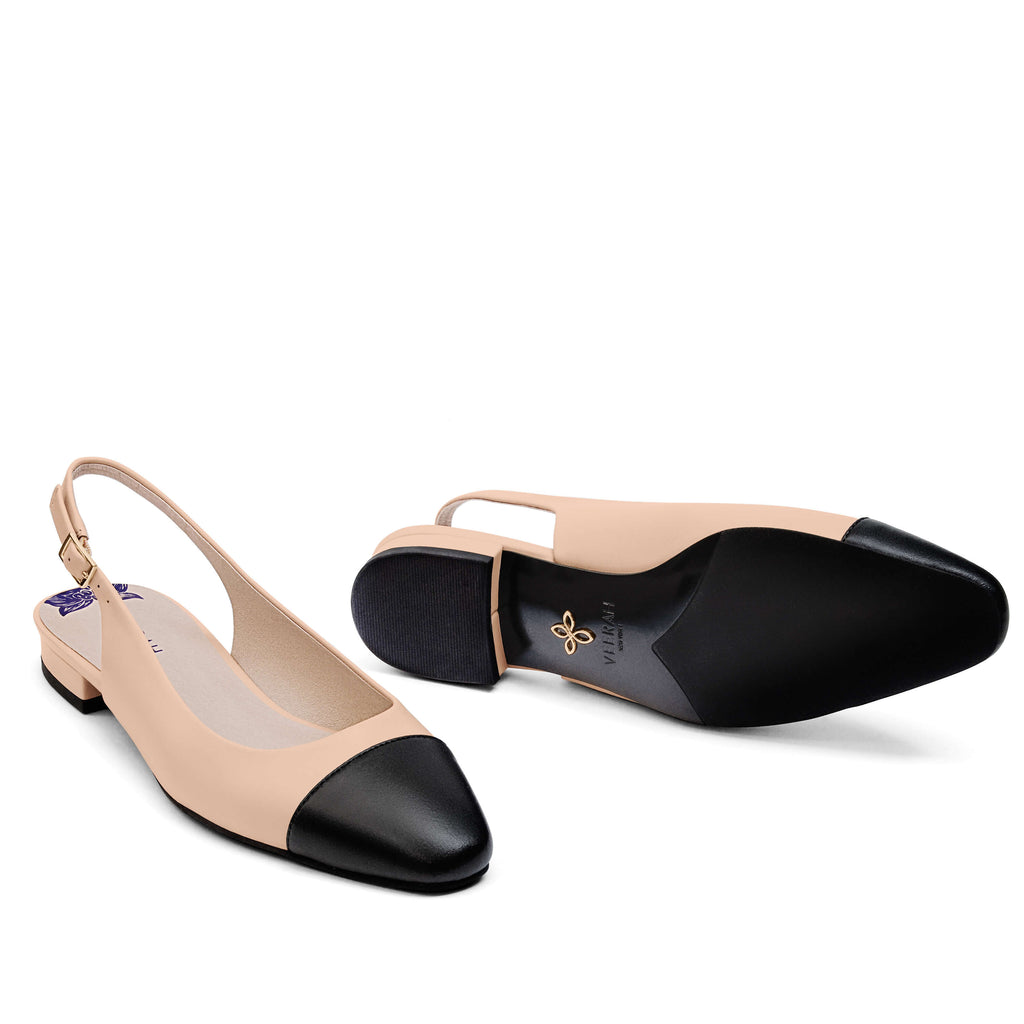 Elegant beige slingback vegan flats with black cap toe and low heel – sophisticated and versatile women's vegan shoes for work, casual, or formal wear.