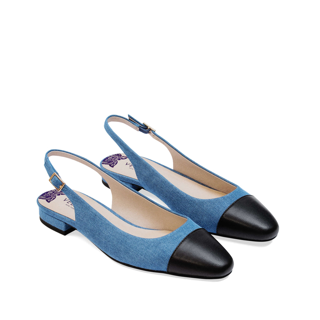 Stylish blue denim slingback vegan flats with black cap toe and low heel – chic and comfortable women's vegan shoes perfect for casual and dressy outfits.