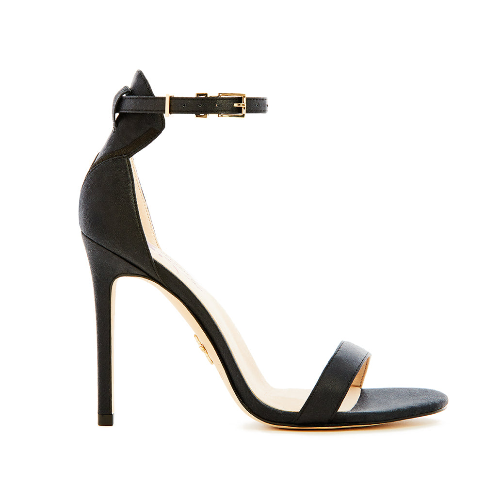Elegant black high-heeled vegan silk sandal, featuring a minimalist ankle strap, and open-toe design, perfect for sophisticated and stylish occasions.