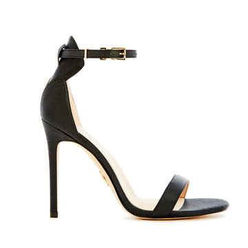 Elegant black high-heeled vegan silk sandal, featuring a minimalist ankle strap, and open-toe design, perfect for sophisticated and stylish occasions.