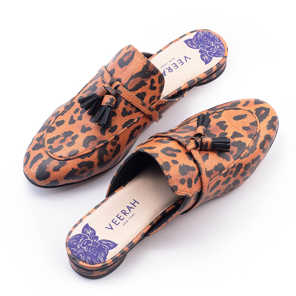 Leopard print apple leather slip-on mules by Veerah with a minimalist design and floral insole detail