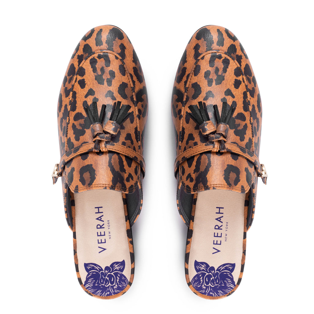 Leopard print apple leather slip-on mules by Veerah with a minimalist design and floral insole detail